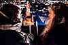 Two people looking at city lights with candles in Helsinki.